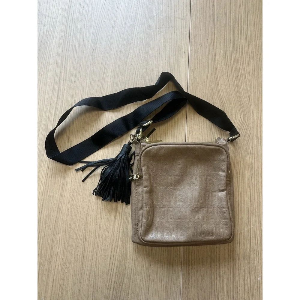 Steve Madden Taupe Embossed Logo Crossbody Bag Tassel Black Strap Gold Hardware
